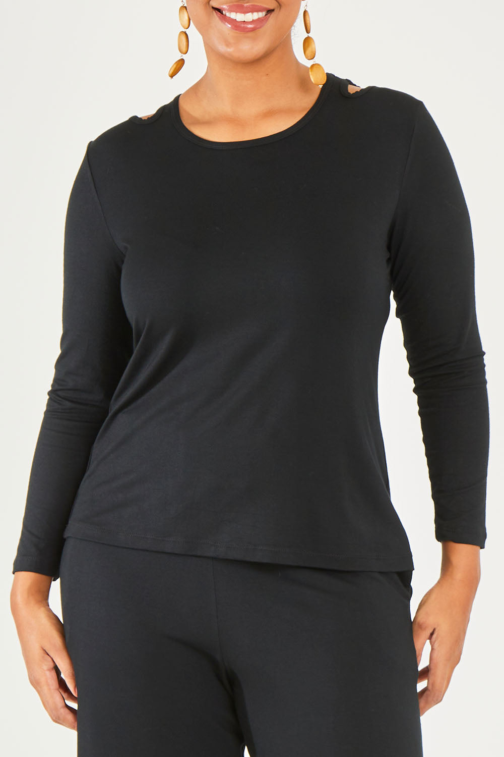 Model Noli wearing size 14 of The Cut Out Jersey Top in colour Black (Black), from the front, cropped image