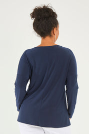 Model Noli wearing size 14 of The Recycled V Neck Double Cuff Top in colour Navy (Blue), from the back