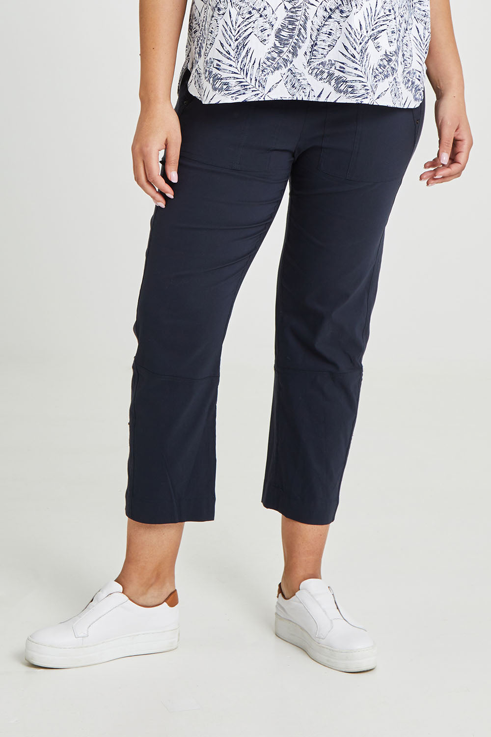 Model Terri-Leigh wearing size 14 of The Casual Pull On Summer Pant in colour Navy (Blue), from the front, cropped image