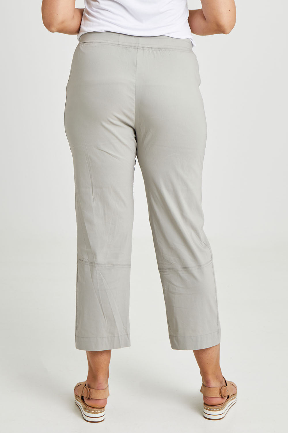Model Terri-Leigh wearing size 14 of The Casual Pull On Summer Pant in colour Parchement (Grey), from the back