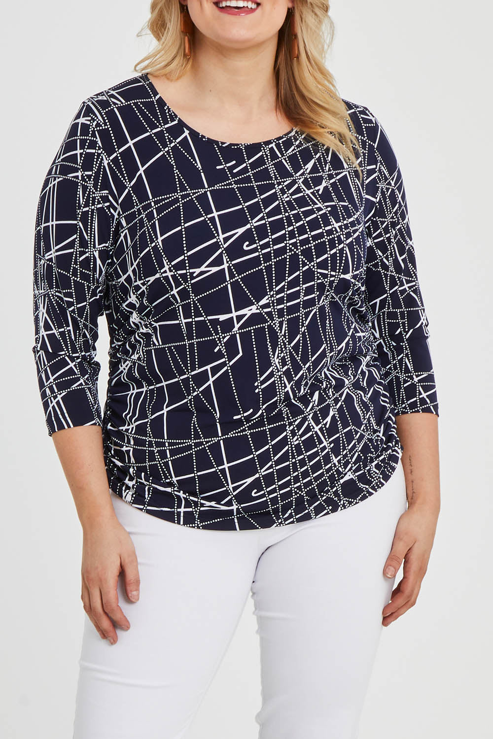 Model Keeara wearing size 16 of The Ruched 3/4 Sleeve Tee in colour Navywhite (Blue), from the front, cropped image
