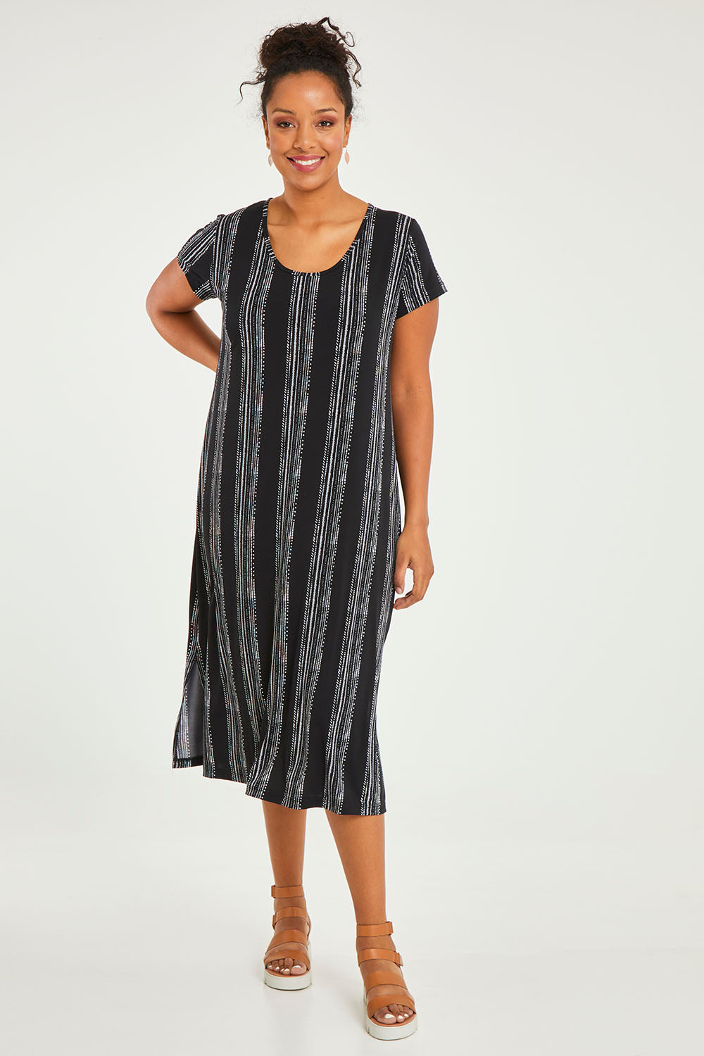 Model Noli wearing size 10 of The Printed Classic Tee Dress in colour Blackwhite (Black), from the front, showing the whole outfit