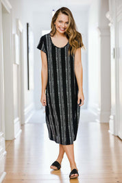 Model Tahlia wearing size 10 of The Printed Classic Tee Dress in colour Blackwhite (Black), from the front, showing the whole outfit