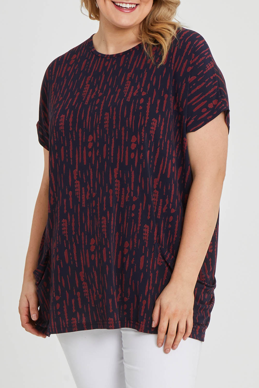 Model Keeara wearing size 16 of The Printed Relaxed Fit Tee in colour Navyred (Blue), from the front, cropped image