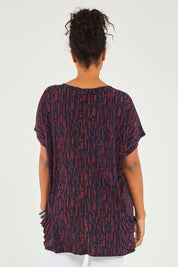 Model Noli wearing size 14 of The Printed Relaxed Fit Tee in colour Navyred (Blue), from the back