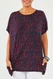 Model Noli wearing size 14 of The Printed Relaxed Fit Tee in colour Navyred (Blue), from the front, cropped image