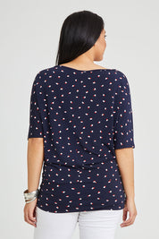 Model Terri-Leigh wearing size 14 of The Printed Wide Basque Top in colour Navyspot (Blue), from the back