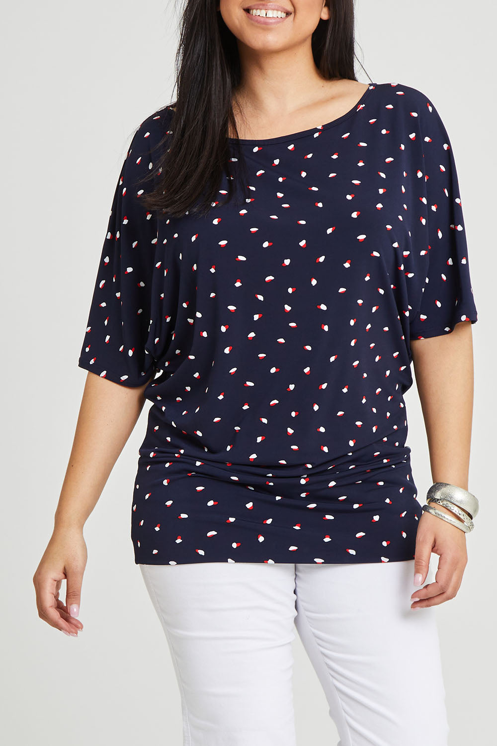 Model Terri-Leigh wearing size 14 of The Printed Wide Basque Top in colour Navyspot (Blue), from the front, cropped image