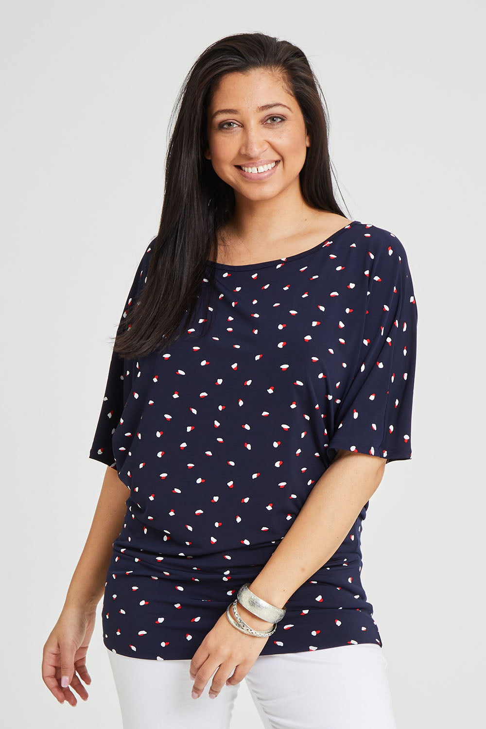 Model Terri-Leigh wearing size 14 of The Printed Wide Basque Top in colour Navyspot (Blue), from the front, cropped image