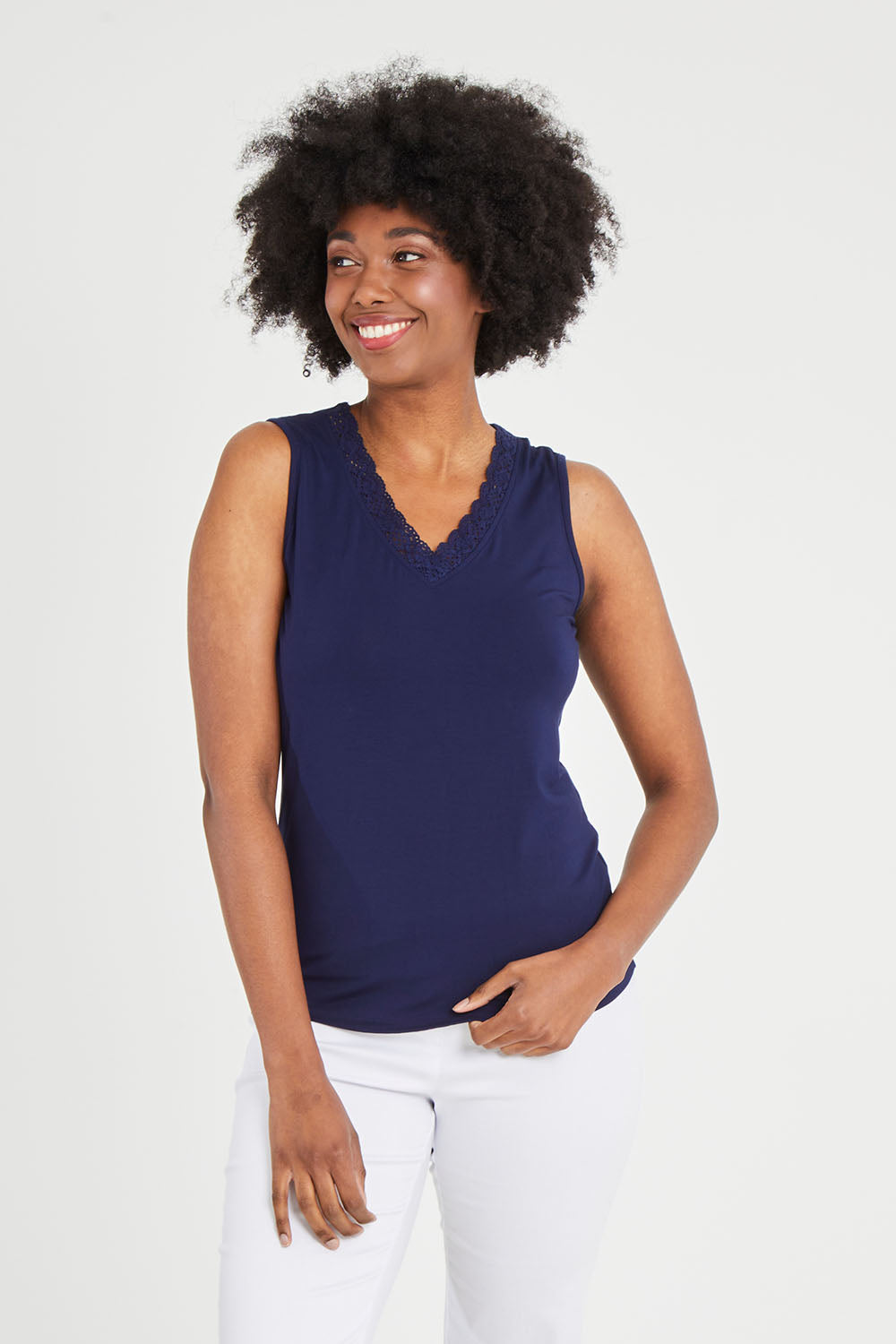 Model Aiyana wearing size 10 of The Classic Lace Trim Tank in colour Navy (Blue), from the front, cropped image