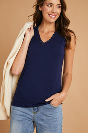 Model Madeline wearing size 10 of The Classic Lace Trim Tank in colour Navy (Blue), from the front, showing the whole outfit