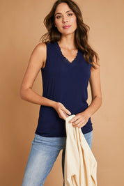 Model Madeline wearing size 10 of The Classic Lace Trim Tank in colour Navy (Blue), from the front, showing the whole outfit