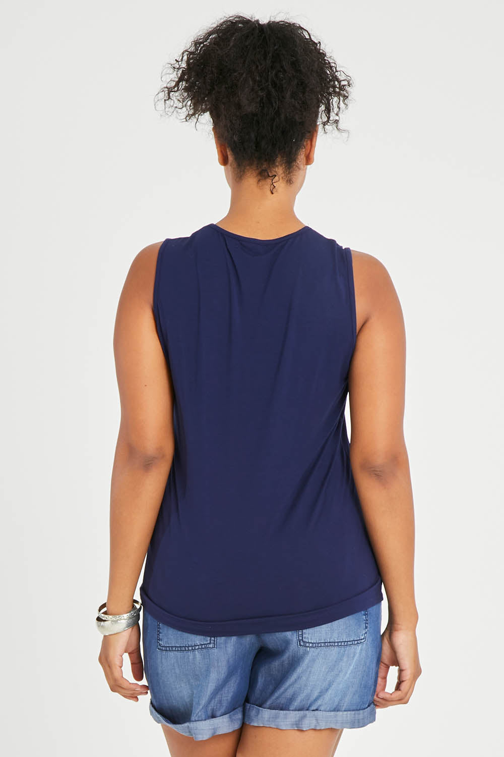 Model Noli wearing size 14 of The Classic Lace Trim Tank in colour Navy (Blue), from the back