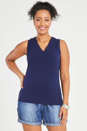 Model Noli wearing size 14 of The Classic Lace Trim Tank in colour Navy (Blue), from the front, cropped image