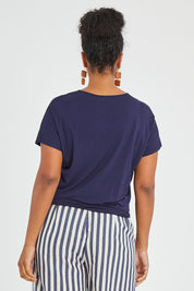 Model Noli wearing size 14 of The Knot Detail Tee in colour Navy (Blue), from the back