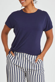 Model Noli wearing size 14 of The Knot Detail Tee in colour Navy (Blue), from the front, cropped image