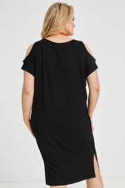 Model Keeara wearing size 16 of The Bamboo Cold Shoulder Dress in colour Black (Black), from the back