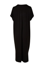 Product shot of The Bamboo Cold Shoulder Dress in colour Black (Black), from the back