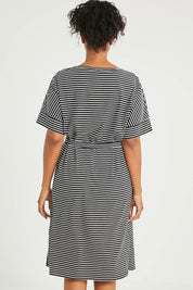 Model Noli wearing size 14 of The Striped Detail Dress in colour Blackwhite (Black), from the back
