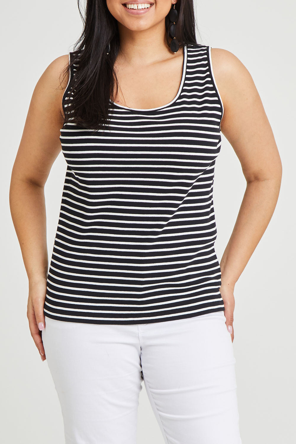 Model Terri-Leigh wearing size 14 of The Keepers Striped Rib Tank in colour Black (Black), from the front, cropped image