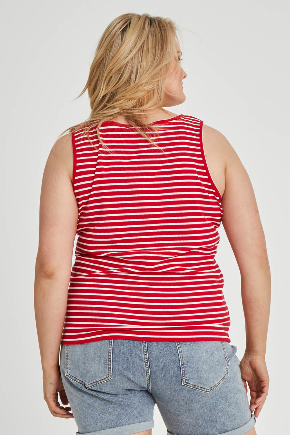 Model Keeara wearing size 16 of The Keepers Striped Rib Tank in colour Red (Red), from the back