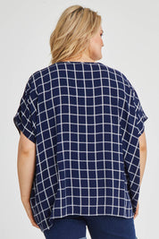 Model Keeara wearing size 16 of The Relaxed Fit Draped Top in colour Navywhite (Black), from the back