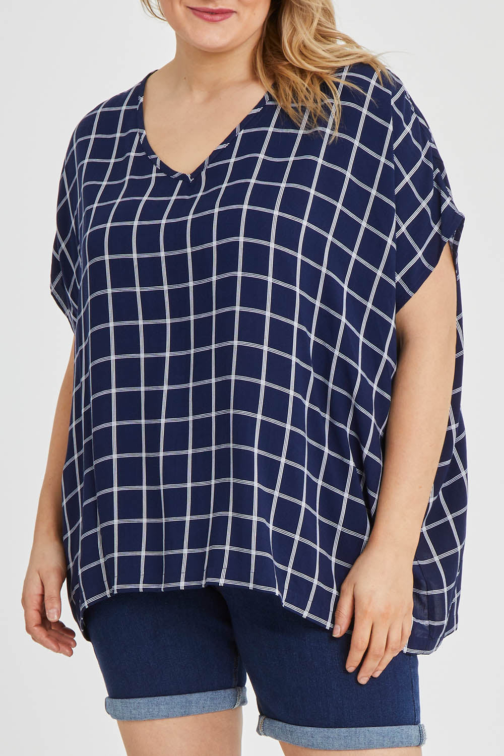 Model Keeara wearing size 16 of The Relaxed Fit Draped Top in colour Navywhite (Black), from the front, cropped image