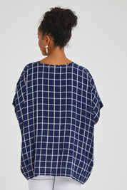 Model Noli wearing size 14 of The Relaxed Fit Draped Top in colour Navywhite (Black), from the back