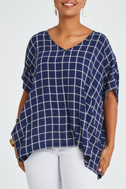 Model Noli wearing size 14 of The Relaxed Fit Draped Top in colour Navywhite (Black), from the front, cropped image