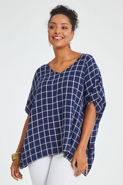 Model Noli wearing size 14 of The Relaxed Fit Draped Top in colour Navywhite (Black), from the front, cropped image