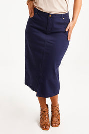 Model Monique wearing size 10 of The 5 Pocket Denim Midi Skirt in colour Navy (Blue), from the front, cropped image