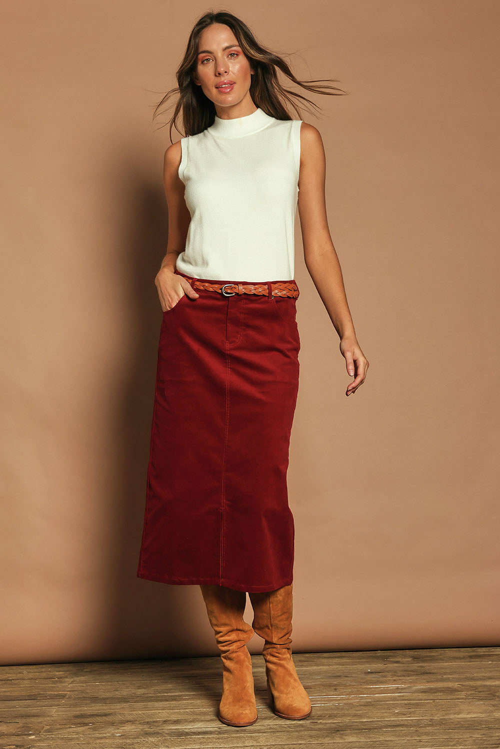 Model Madeline wearing size 10 of The 5 Pocket Cord Midi Skirt in colour Cherryred (Red), from the front, showing the whole outfit