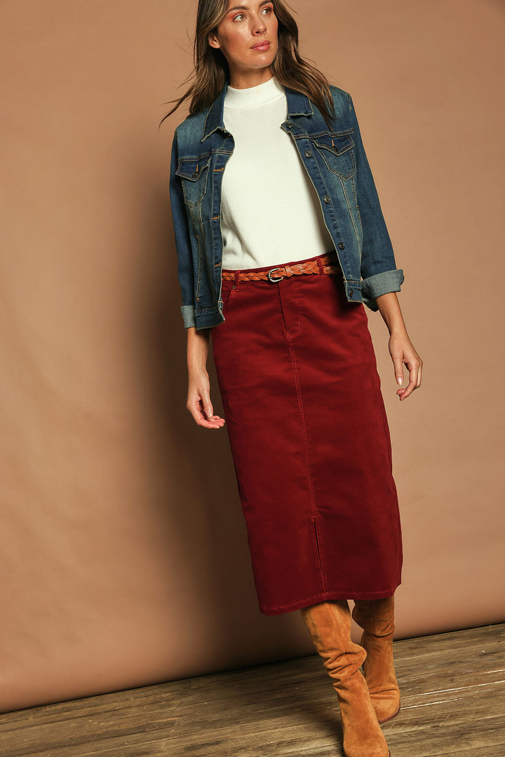 Model Madeline wearing size 10 of The 5 Pocket Cord Midi Skirt in colour Cherryred (Red), from the front, showing the whole outfit