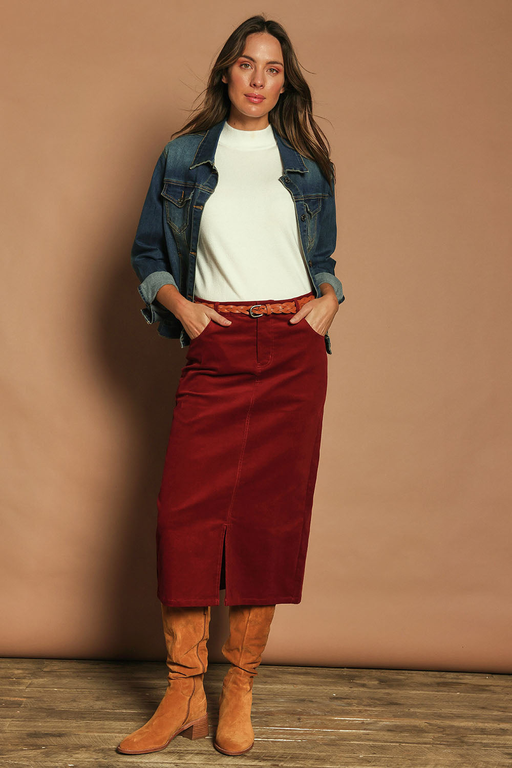 Model Madeline wearing size 10 of The 5 Pocket Cord Midi Skirt in colour Cherryred (Red), from the front, showing the whole outfit