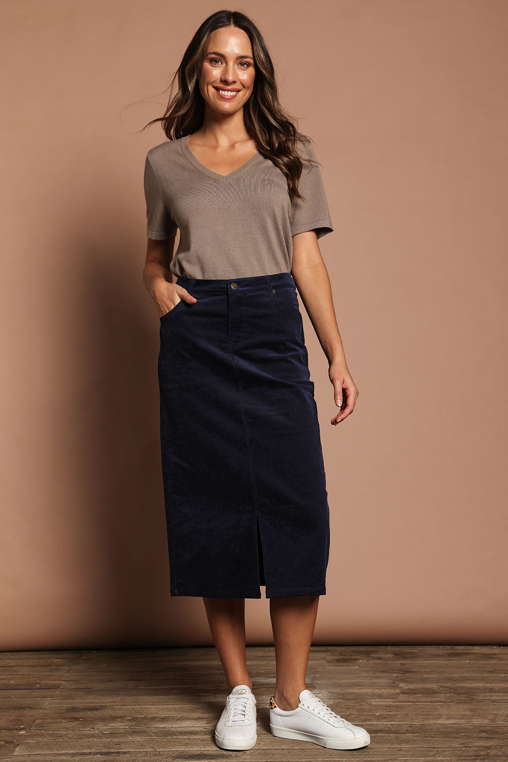 Model Maddy wearing size 10 of The 5 Pocket Cord Midi Skirt in colour Darknavy (Blue), from the front, showing the whole outfit