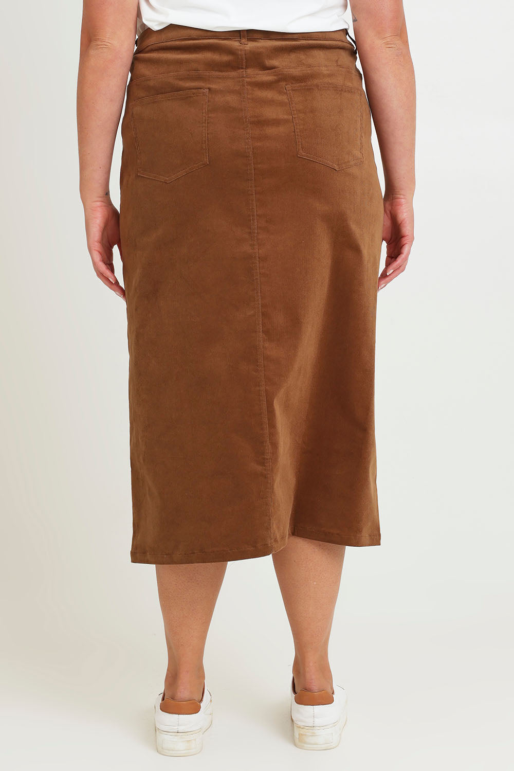 Model Chanel wearing size 16 of The 5 Pocket Cord Midi Skirt in colour Malt, from the back