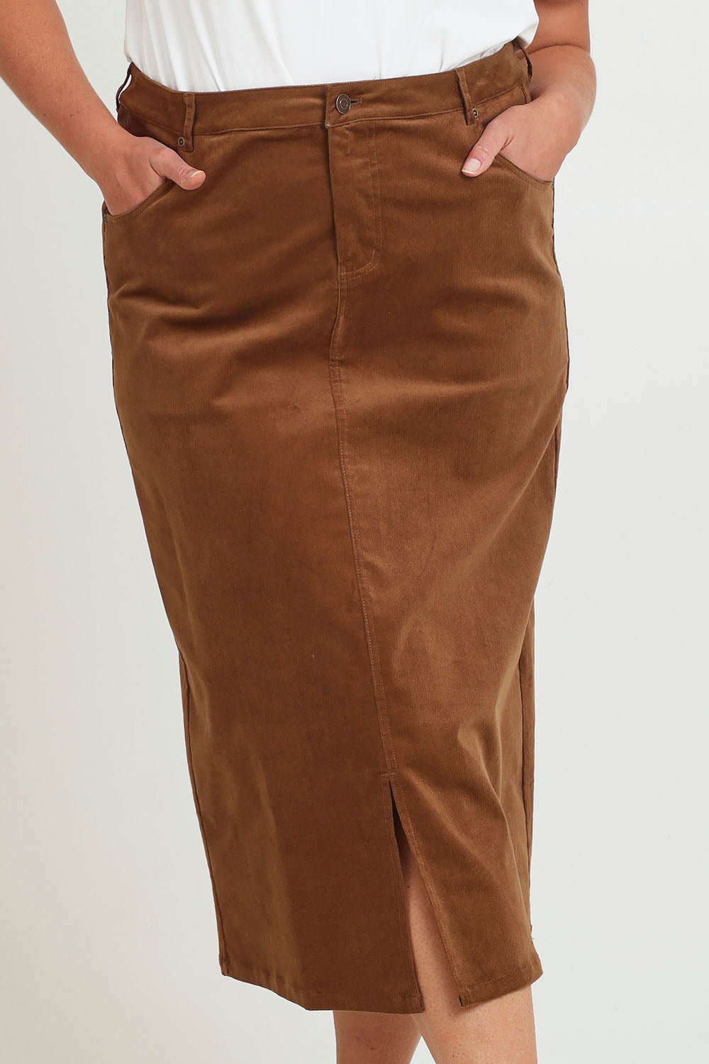 Model Chanel wearing size 16 of The 5 Pocket Cord Midi Skirt in colour Malt, from the front, cropped image