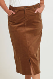 Model Chanel wearing size 16 of The 5 Pocket Cord Midi Skirt in colour Malt, from the front, cropped image