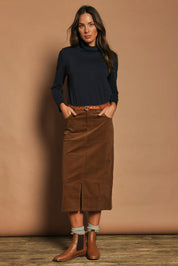 Model Madeline wearing size 10 of The 5 Pocket Cord Midi Skirt in colour Malt, from the front, showing the whole outfit