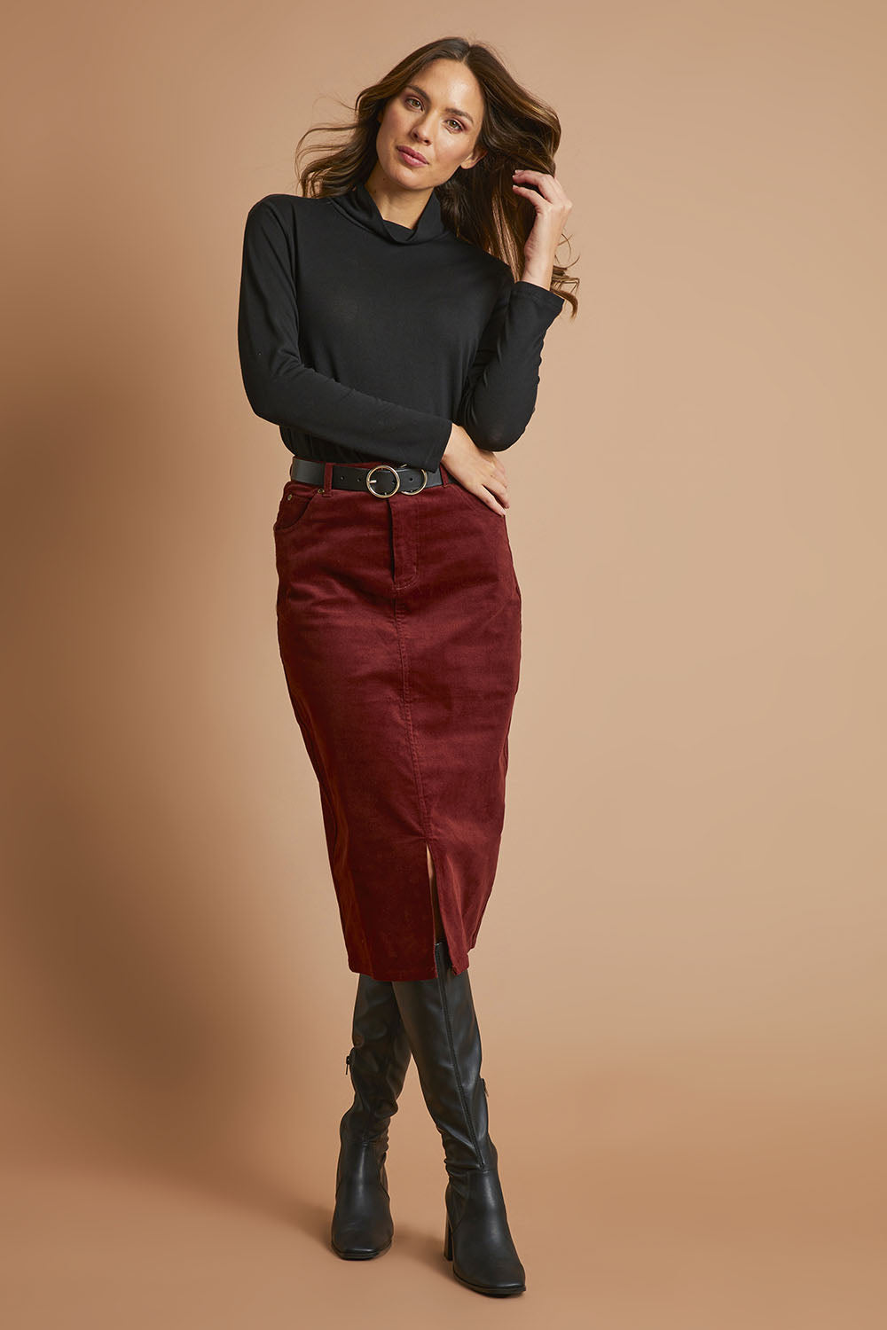 Model Madeline wearing size 10 of The 5 Pocket Cord Midi Skirt in colour Nutmeg, from the front, showing the whole outfit