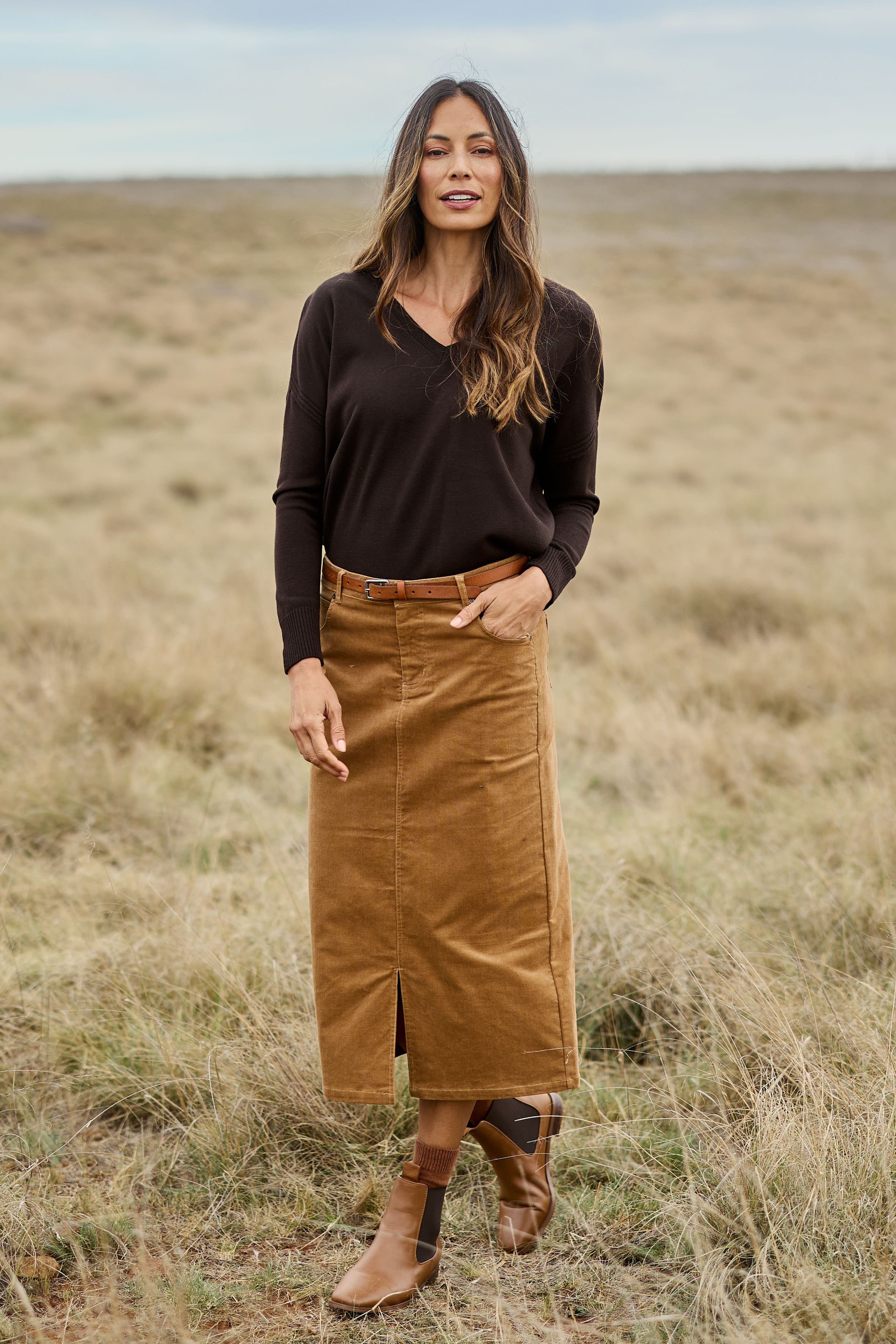 Model Amanda wearing size 10 of The 5 Pocket Cord Midi Skirt in colour Tan, from the front, showing the whole outfit