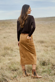 Model Amanda wearing size 10 of The 5 Pocket Cord Midi Skirt in colour Tan, from the front, showing the whole outfit