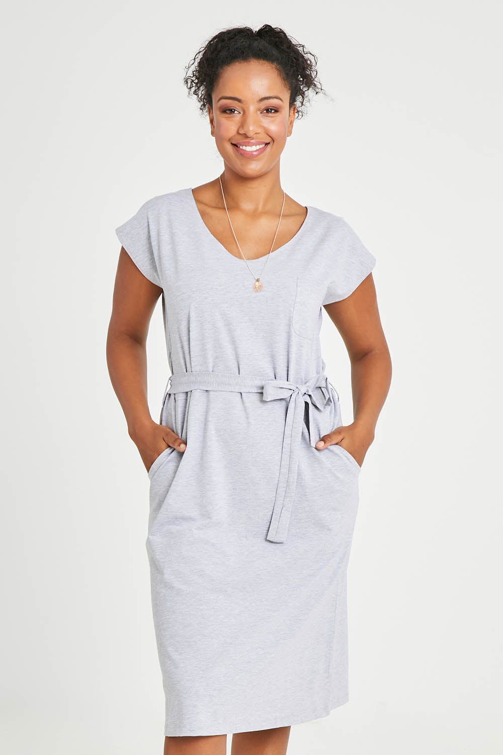 Model Noli wearing size 14 of The Summer Tee Dress in colour Silvermarl (Grey), from the front, cropped image