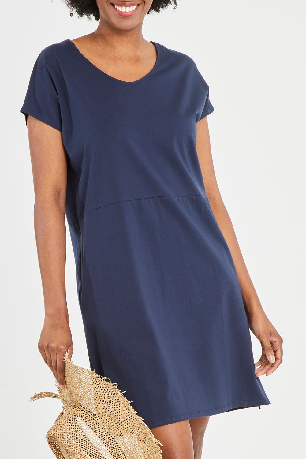 Model Aiyana wearing size 10 of The Luxe Cotton Tee Dress in colour Navy (Blue), from the front, cropped image
