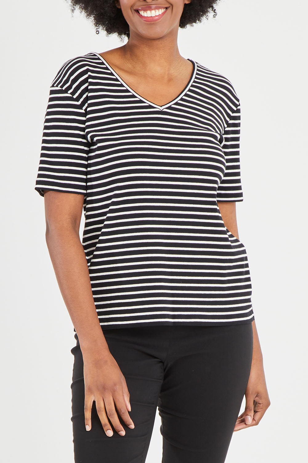 Model Aiyana wearing size 10 of The Keepers V Neck Striped Rib Tee in colour Black (Black), from the front, cropped image
