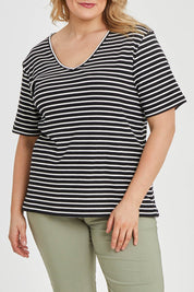 Model Keeara wearing size 16 of The Keepers V Neck Striped Rib Tee in colour Black (Black), from the front, cropped image