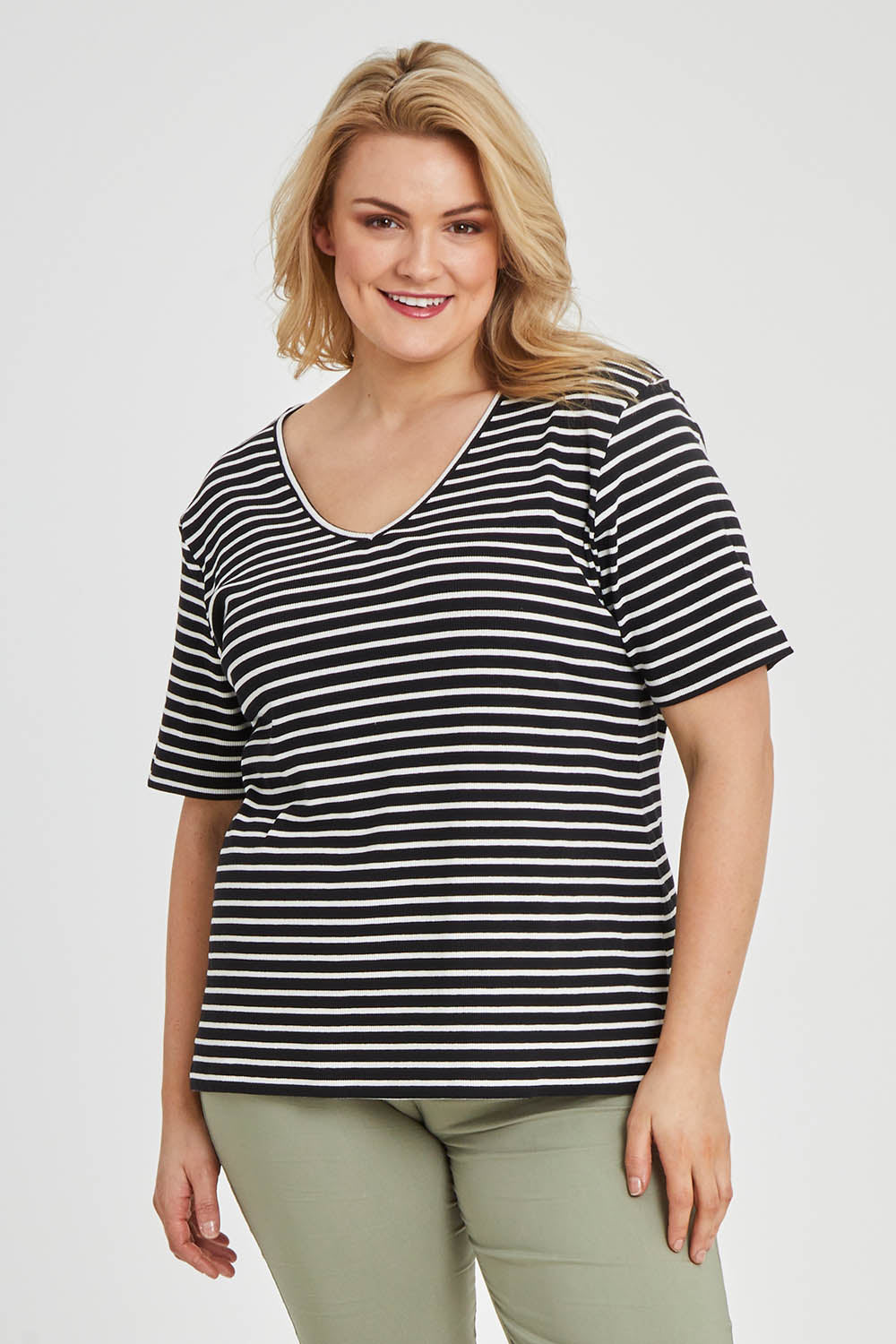 Model Keeara wearing size 16 of The Keepers V Neck Striped Rib Tee in colour Black (Black), from the front, cropped image