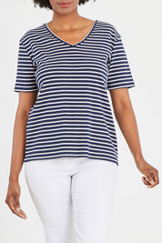Model Aiyana wearing size 10 of The Keepers V Neck Striped Rib Tee in colour Navy (Blue), from the front, cropped image