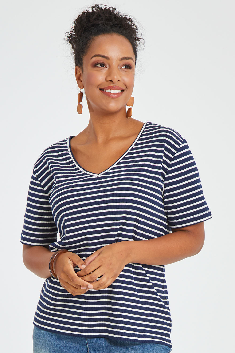 Model Noli wearing size 14 of The Keepers V Neck Striped Rib Tee in colour Navy (Blue), from the front, cropped image