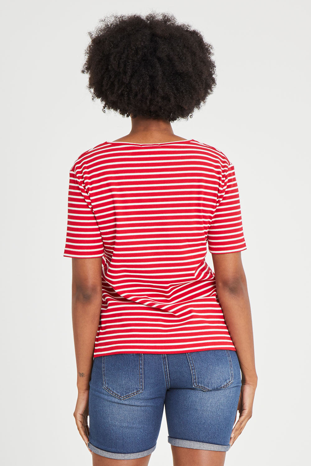 Model Aiyana wearing size 10 of The Keepers V Neck Striped Rib Tee in colour Red (Red), from the back